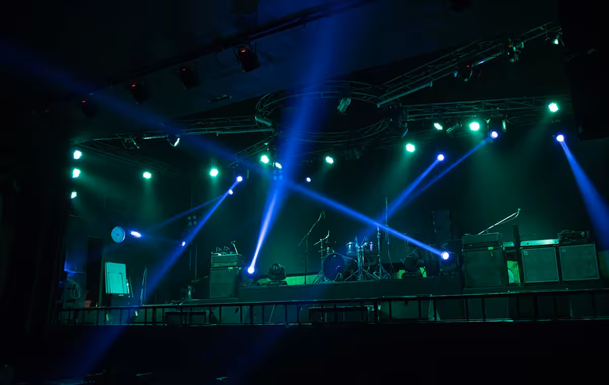 Empty stage concert with colorful lighting laser beam spotlight show in disco pub club bar background for party music dancing festival performance. Entertainment nightlife. Celebration event.